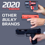 Three hands hold different non-lethal devices to compere their sizes. The HERO 2020 at the top is the smallest. Text on the image states 