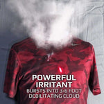 An irritant filled projectile caught mid explosion upon hitting a target dummy. A burst of powder blasts upwards from the chest towards the face area. Text on the image reads 