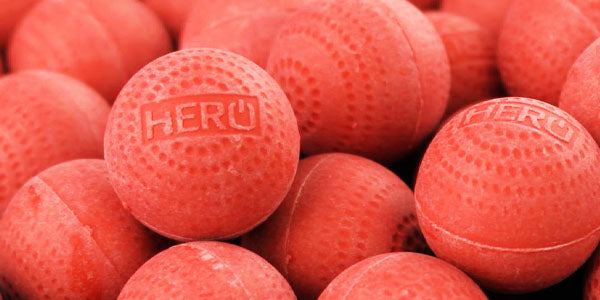 A close up of a pile of Maximus Non-Lethal projectiles